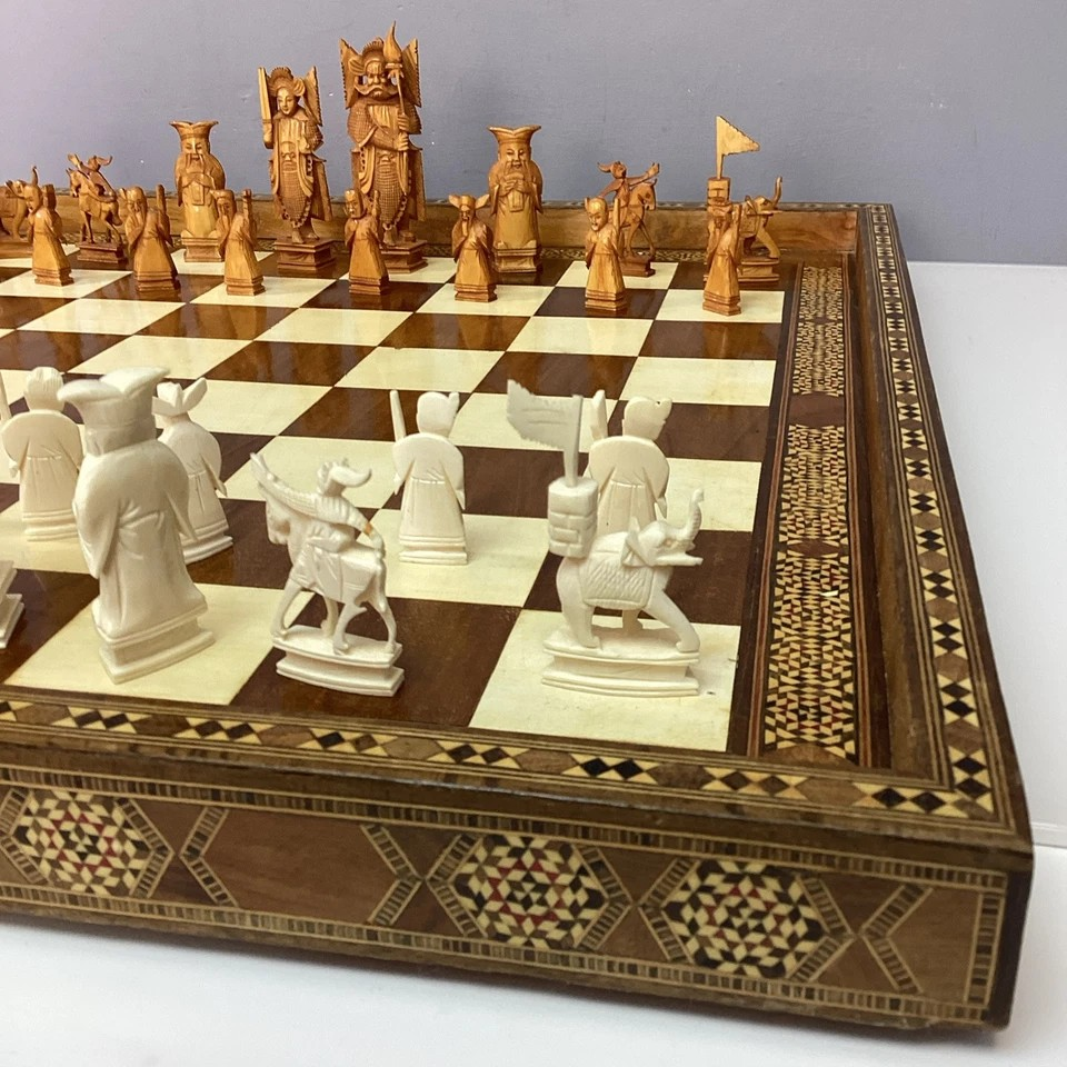 Hand Made Wooden Chess Board + Oriental Carved Chess Set Pieces showcasing intricate designs and craftsmanship.