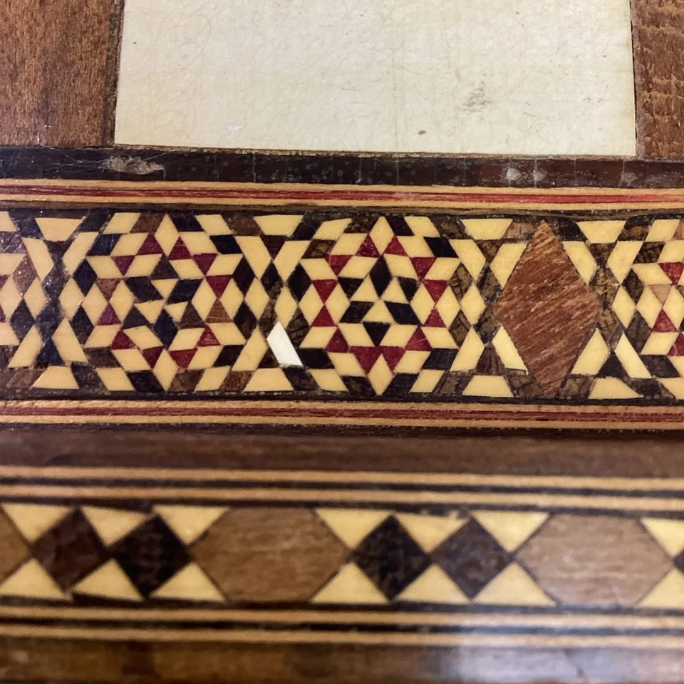Detailed view of intricate Oriental carvings on the Hand Made Wooden Chess Board + Oriental Carved Chess Set Pieces.