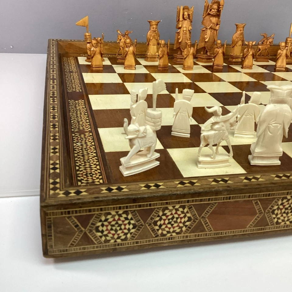 Hand Made Wooden Chess Board + Oriental Carved Chess Set Pieces showcasing intricate Mother-of-Pearl inlays and detailed carvings.